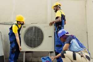 AC Repair in Greenview 1 Dubai – Fast, Affordable & 24/7 Air Conditioner Service in DIP 1 team replacing old air conditioner 1 min 300x200 1